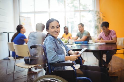 handicapped-business-executive-using-digital-tablet